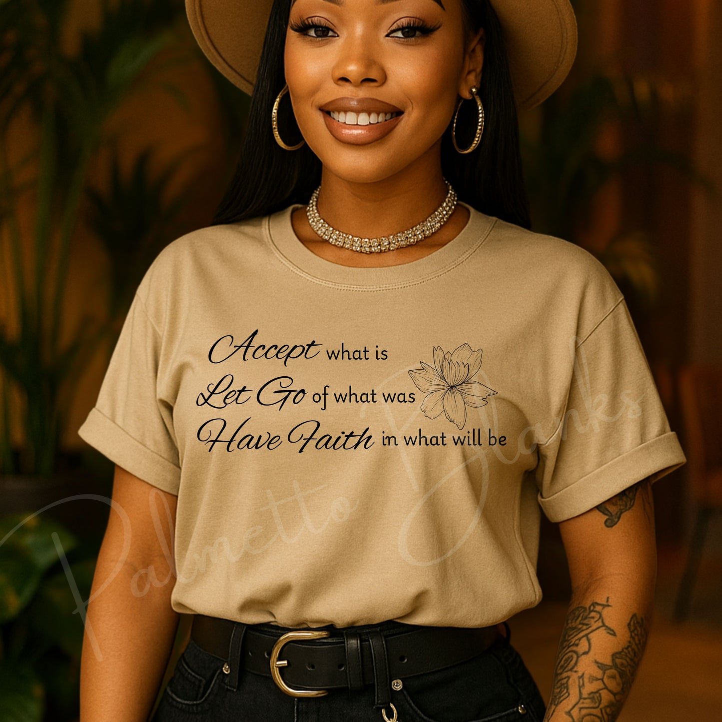 Tan t-shirt featuring the inspirational quote “Accept what is, Let Go of what was, Have Faith in what will be” in elegant script with a lotus flower line art.