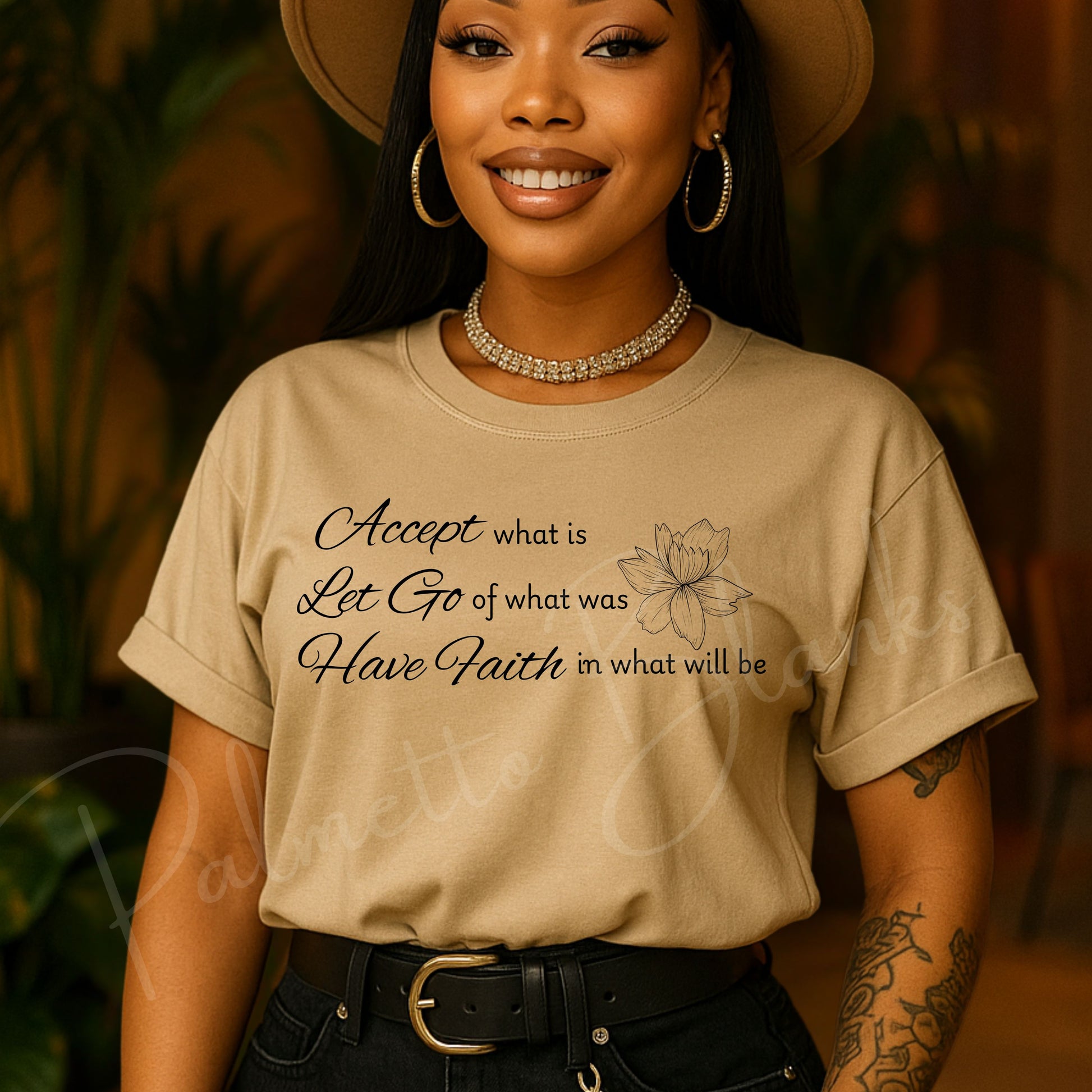 Tan t-shirt featuring the inspirational quote “Accept what is, Let Go of what was, Have Faith in what will be” in elegant script with a lotus flower line art.